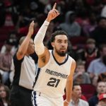 
              Memphis Grizzlies guard Tyus Jones (21) reacts after making a three point basket during the first half of an NBA basketball game against the Houston Rockets, Sunday, March 20, 2022, in Houston. (AP Photo/Eric Christian Smith)
            