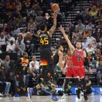 
              Utah Jazz guard Donovan Mitchell (45) shoots as Chicago Bulls guard Zach LaVine (8) defends during the second half of an NBA basketball game Wednesday, March 16, 2022, in Salt Lake City. (AP Photo/Rick Bowmer)
            