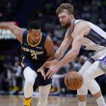
              New Orleans Pelicans guard CJ McCollum (3) chases a loose ball against Sacramento Kings forward Domantas Sabonis in the second half of an NBA basketball game in New Orleans, Wednesday, March 2, 2022. The Pelicans won 125-95. (AP Photo/Gerald Herbert)
            