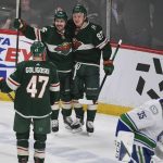 
              Minnesota Wild left wing Kirill Kaprizov, right celebrates with right wing Mats Zuccarello, center, and defenseman Alex Goligoski (47) after Kaprizov scored against Vancouver Canucks goalie Thatcher Demko (35) during the first period of an NHL hockey game Thursday, March 24, 2022, in St. Paul, Minn. (AP Photo/Craig Lassig)
            