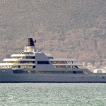 
              A view of Russian metals and petroleum magnate Roman Abramovich's superyacht Solaris anchored in Tivat, Montenegro, Saturday, March 12, 2022. President Joe Biden has warned Kremlin-aligned oligarchs that the U.S. and its European allies are coming for their superyachts. But actually seizing the behemoth vessels often worth hundreds of millions of dollars could prove challenging. Many of the boats are flagged and registered in secretive banking havens used by the ultra-rich to shield their wealth from taxes or seizures.   Abramovich's superyacht Solaris, stands eight stories tall, and features a sleek palisade of broad teak-covered decks suitable for hosting a horde of well-heeled partygoers. (AP Photo/Risto Bozovic)
            