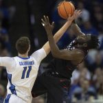 
              Creighton's Ryan Kalkbrenner (11) reaches for a rebound against Connecticut's Adama Sanogo during the first half of an NCAA college basketball game Wednesday, March 2, 2022, in Omaha, Neb. (AP Photo/Rebecca S. Gratz)
            
