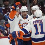 
              New York Islanders center Jean-Gabriel Pageau, left, celebrates his goal against the Colorado Avalanche with right wing Cal Clutterbuck, left wing Zach Parise and defenseman Andy Greene, back right, during the second period of an NHL hockey game Tuesday, March 1, 2022, in Denver. (AP Photo/David Zalubowski)
            
