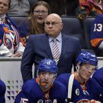 
              New York Islanders head coach Barry Trotz, center, looks on in the first period of an NHL hockey game against the Anaheim Ducks, Sunday, March 13, 2022, in Elmont, N.Y. (AP Photo/Adam Hunger)
            