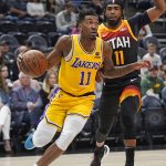 
              Los Angeles Lakers guard Malik Monk, left, goes to the basket as Utah Jazz guard Mike Conley defends during the first half of an NBA basketball game Thursday, March 31, 2022, in Salt Lake City. (AP Photo/Rick Bowmer)
            