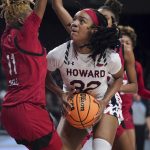 
              Howard forward Krislyn Marsh (32) drives against Incarnate Word guard Myra Bell (11) during the first half of a First Four game in the NCAA women's college basketball tournament Wednesday, March 16, 2022, in Columbia, S.C. (AP Photo/Sean Rayford)
            