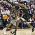 
              Texas A&M's Tyrece Radford drives to the basket against Wake Forest's Khadim Sy (20) during the first half of an NCAA college basketball game in the third round of the NIT in College Station, Texas, Wednesday, March 23, 2022. (Michael Miller/College Station Eagle via AP)
            