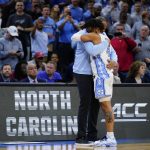 
              North Carolina's R.J. Davis, right, and Hubert Davis celebrate after a college basketball game against St. Peter's in the Elite 8 round of the NCAA tournament, Sunday, March 27, 2022, in Philadelphia. (AP Photo/Matt Rourke)
            
