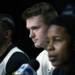 
              Miami forward Sam Waardenburg, center, listens to a question during a news conference at the NCAA men's college basketball tournament Thursday, March 24, 2022, in Chicago. Miami faces Iowa State in a Sweet 16 game on Friday. (AP Photo/Nam Y. Huh)
            