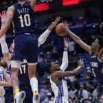 
              Sacramento Kings guard De'Aaron Fox goes to the basket against New Orleans Pelicans forward Herbert Jones (5) in the first half of an NBA basketball game in New Orleans, Wednesday, March 2, 2022. (AP Photo/Gerald Herbert)
            