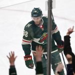 
              Fans cheers after Minnesota Wild right wing Ryan Hartman (38) scored a goal against the New York Rangers in the first period of an NHL hockey game Tuesday, March 8, 2022, in St. Paul, Minn. (AP Photo/Andy Clayton-King)
            
