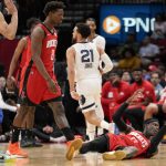 
              Houston Rockets guard Dennis Schroder, bottom right, reacts after being called for a foul during the first half of an NBA basketball game against the Memphis Grizzlies, Sunday, March 20, 2022, in Houston. (AP Photo/Eric Christian Smith)
            