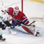 
              Seattle Kraken's Marcus Johansson (90) scores against Montreal Canadiens goaltender Sam Montembeault, right, during shootout NHL hockey action in Montreal, Saturday, March 12, 2022. (Graham Hughes/The Canadian Press via AP)
            