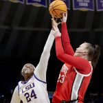 
              LSU center Faustine Aifuwa (24) blocks the shot of Ohio State forward Rebeka Mikulasikova (23) during the first half of a college basketball game in the second round of the NCAA tournament, Monday, March 21, 2022, in Baton Rouge, La. (AP Photo/Matthew Hinton)
            