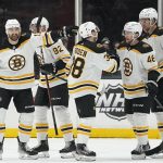 
              Boston Bruins left wing Nick Foligno, left, celebrates with teammates after scoring a goal during the second period of an NHL hockey game against the Anaheim Ducks in Anaheim, Calif., Tuesday, March 1, 2022. (AP Photo/Ashley Landis)
            