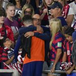 
              United States' Christian Pulisic, in orange top, is hugged by his father Mark Pulisic, center, after Christian Pulisic scored three goals in a FIFA World Cup qualifying soccer match against Panama, Sunday, March 27, 2022, in Orlando, Fla. The U.S. won 5-1. (AP Photo/Julio Cortez)
            