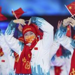 
              Members of the China Paralympic team wave flags during the athletes parade at the opening ceremonies of the Beijing 2022 Winter Paralympic Games in Beijing, China, Friday, March 4, 2022. (Joe Toth/OIS via AP)
            