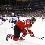 
              New Jersey Devils left Wing Tomas Tatar (90) control the puck against the Winnipeg Jets during the second period of an NHL hockey game Thursday, March 10, 2022, in Newark, N.J. (AP Photo/Eduardo Munoz Alvarez)
            