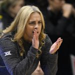 
              CORRECTS SCHOOL TO OKLAHOMA STATE INSTEAD OF OKLAHOMA - Baylor head coach Nicki Collen cheers her team on against Oklahoma State during the first half of an NCAA college basketball game in the Big 12 Conference tournament in Kansas City, Kan., Friday, March 11, 2022. (AP Photo/Reed Hoffmann)
            