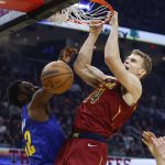 
              Cleveland Cavaliers' Lauri Markkanen (24) dunks against Denver Nuggets' Jeff Green, left, during the first half of an NBA basketball game, Friday, March 18, 2022, in Cleveland. (AP Photo/Ron Schwane)
            