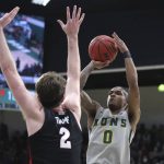 
              FILE - San Francisco guard Khalil Shabazz (0) shoots against Gonzaga forward Drew Timme (2) during the first half of an NCAA college basketball game in San Francisco, Calif., Feb. 24, 2022. San Francisco coach Todd Golden believes that Shabazz and Jamaree Bouyea "can play against anybody in America." (AP Photo/Jed Jacobsohn, File)
            