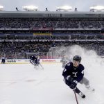 
              Toronto Maple Leafs forward Pierre Engvall (47) sprays ice as he turns during third-period NHL Heritage Classic hockey game action against the Buffalo Sabres in Hamilton, Ontario, Sunday, March 13, 2022. (Frank Gunn/The Canadian Press via AP)
            