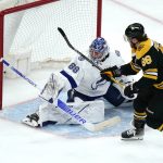 
              Boston Bruins right wing David Pastrnak, right, shoots the puck past Tampa Bay Lightning goaltender Andrei Vasilevskiy during the second period of an NHL hockey game, Thursday, March 24, 2022, in Boston. (AP Photo/Charles Krupa)
            