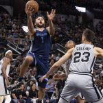 
              Memphis Grizzlies forward Kyle Anderson (1) drives to the basket against San Antonio Spurs forward Zach Collins (23) during the second half of an NBA basketball game Wednesday, March 30, 2022, in San Antonio. (AP Photo/Nick Wagner)
            