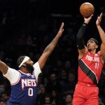 
              Portland Trail Blazers guard Josh Hart (11) shoots against Brooklyn Nets center Andre Drummond (0) in the first half of an NBA basketball game, Friday, March 18, 2022, in New York. (AP Photo/John Minchillo)
            