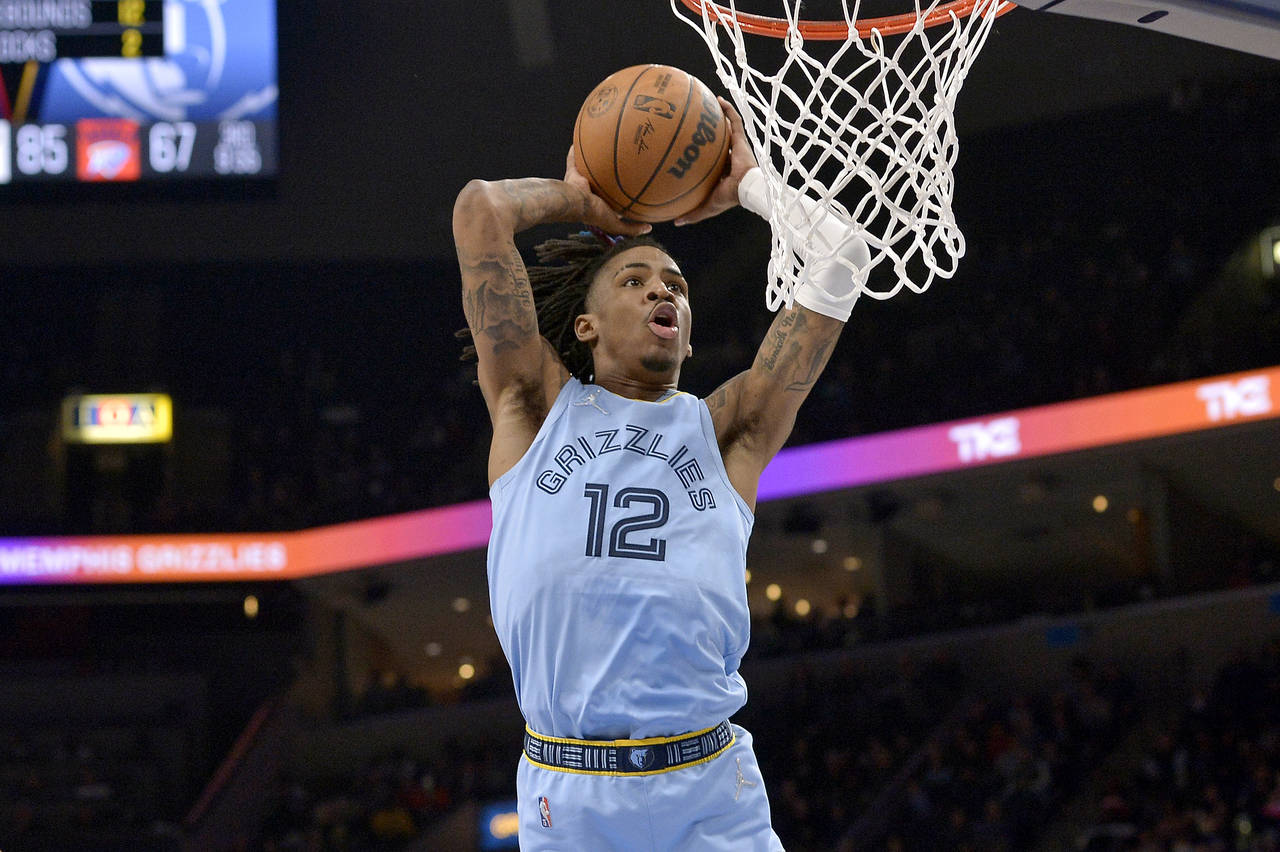 Memphis Grizzlies guard Ja Morant goes up for a dunk during the second half of the team's NBA baske...