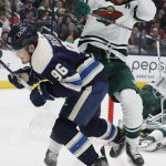 
              Minnesota Wild's Marcus Foligno, right, checks Columbus Blue Jackets' Jack Roslovic during the second period of an NHL hockey game Friday, March 11, 2022, in Columbus, Ohio. (AP Photo/Jay LaPrete)
            