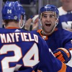 
              New York Islanders right wing Kyle Palmieri, right, reacts with defenseman Scott Mayfield (24) after scoring a goal in the second period of an NHL hockey game against the Anaheim Ducks, Sunday, March 13, 2022, in Elmont, N.Y. (AP Photo/Adam Hunger)
            