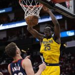 
              Indiana Pacers' Jalen Smith (25) dunks the ball as Houston Rockets' Alperen Sengun defends during the first half of an NBA basketball game Friday, March 18, 2022, in Houston. (AP Photo/David J. Phillip)
            