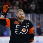
              Philadelphia Flyers' Claude Giroux acknowledges the crowd after playing in his 1000th NHL hockey game, Thursday, March 17, 2022, in Philadelphia. (AP Photo/Matt Slocum)
            