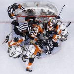 
              Philadelphia Flyers players and Vegas Golden Knights players wrestle during the first period of an NHL hockey game, Tuesday, March 8, 2022, in Philadelphia. (AP Photo/Matt Slocum)
            