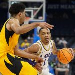 
              LSU guard Xavier Pinson, right, makes a move to get past Missouri forward Ronnie DeGray III during the first half of an NCAA college basketball game at the Southeastern Conference tournament in Tampa, Fla., Thursday, March 10, 2022. (AP Photo/Chris O'Meara)
            