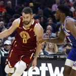 
              Cleveland Cavaliers' Kevin Love (0) drives against Philadelphia 76ers' Shake Milton (18) during the first half of an NBA basketball game Wednesday, March 16, 2022, in Cleveland. (AP Photo/Ron Schwane)
            