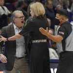 
              Connecticut head coach Geno Auriemma, left, is held back by associate head coach Chris Dailey, center, while arguing a call with official Benny Luna, right, during the second half of a second-round women's college basketball game against Central Florida in the NCAA tournament, Monday, March 21, 2022, in Storrs, Conn. (AP Photo/Jessica Hill)
            