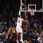 
              Los Angeles Clippers center Ivica Zubac (40) shoots over defending Atlanta Hawks center Clint Capela (15) during the second half of an NBA basketball game Friday, March 11, 2022, in Atlanta. (AP Photo/Hakim Wright Sr.)
            