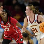 
              Iowa State guard Lexi Donarski (21) drives past Georgia guard Que Morrison (23) during the first half of a second-round game in the NCAA women's college basketball tournament, Sunday, March 20, 2022, in Ames, Iowa. (AP Photo/Charlie Neibergall)
            