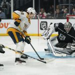 
              Los Angeles Kings goaltender Jonathan Quick (32) stops a shot by Nashville Predators right wing Eeli Tolvanen (28) during the third period of an NHL hockey game Tuesday, March 22, 2022, in Los Angeles. (AP Photo/Ashley Landis)
            