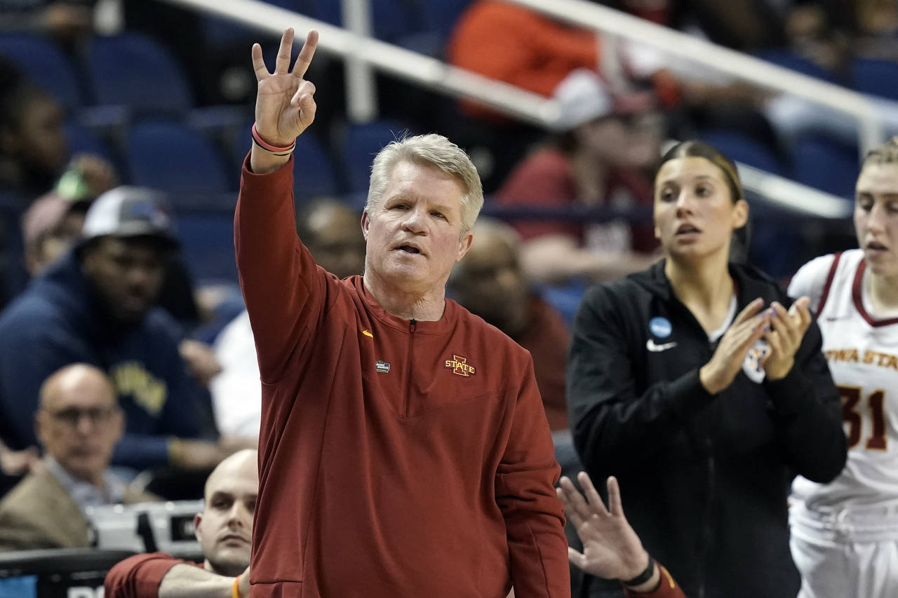 Iowa State coach Bill Fennelly gestures during the first half of the team's college basketball game...