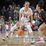 
              Stanford guard Lacie Hull (24) moves the ball against Oregon State during an NCAA college basketball game in the quarterfinals of the Pac-12 women's tournament Thursday, March 3, 2022, in Las Vegas. (AP Photo/David Becker)
            
