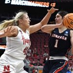 Gonzaga forward Anamaria Virjoghe (1) tries to keep the ball away from Nebraska center Alexis Markowski (40) during the first half of their women's NCAA Tournament college basketball first round game, Louisville, Ky., Friday, March 18, 2022. (AP Photo/Timothy D. Easley)