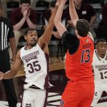 
              Mississippi State forward Tolu Smith (35) attempts to block a shot by Auburn forward Walker Kessler (13) during the first half of an NCAA college basketball game in Starkville, Miss., Wednesday, March. 2, 2022. (AP Photo/Rogelio V. Solis)
            