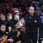 
              Duke coach Mike Krzyzewski, second from right, watches the game as forward AJ Griffin (21) and the bench celebrate a basket against Syracuse during the second half of an NCAA college basketball game in Syracuse, N.Y., Saturday, Feb. 26, 2022. Duke won 97-72. (AP Photo/Adrian Kraus)
            