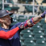 
              Minnesota Twins' Carlos Correa adjusts his arm protector during batting batting practice at Hammond Stadium Wednesday March 23, 2022, in Fort Myers, Fla.  (AP Photo/Steve Helber)
            