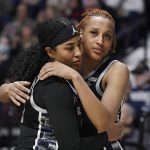 
              Georgetown's Milan Bolden-Morris, left, and Jillian Archer, embrace near the end of the second half of an NCAA college basketball game against Connecticut in the quarterfinals of the Big East Conference tournament at Mohegan Sun Arena, Saturday, March 5, 2022, in Uncasville, Conn. (AP Photo/Jessica Hill)
            