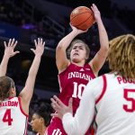 
              Indiana forward Aleksa Gulbe (10) shoots over Ohio State guards Jacy Sheldon (4) and Kateri Poole (5) in the second half of an NCAA college basketball game at the Big Ten Conference tournament in Indianapolis, Saturday, March 5, 2022. Indiana defeated Ohio State 70-62. (AP Photo/Michael Conroy)
            