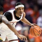 
              Illinois' Trent Frazier eyes a passing outlet during the first half of an NCAA college basketball game against Iowa, Sunday, March 6, 2022, in Champaign, Ill. (AP Photo/Michael Allio)
            